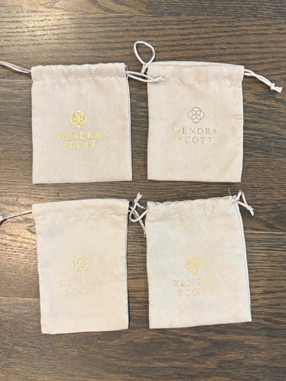 Kendra Scott Light Beige Drawstring Jewelry Pouches with Gold Logo - Set of 4